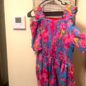 This is a rainbow colored shirt from the ROUGE Collection in a size 2X.